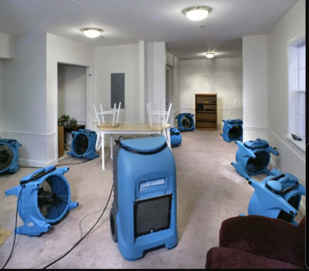 Air movers and dehumidifier setup for Water Damage Restoration in New Kingman-Butler